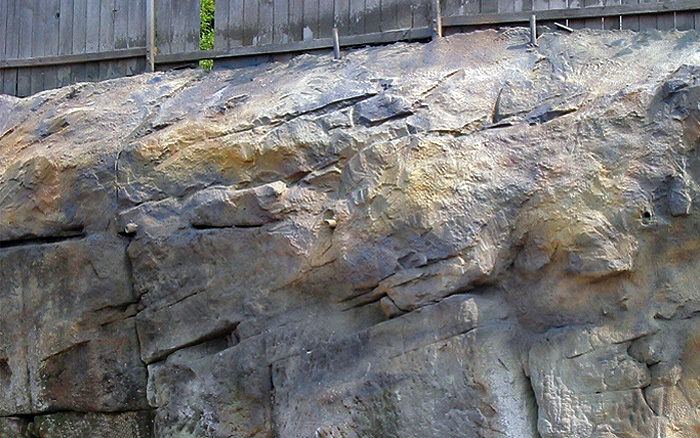 Mock rock over shotcrete retaining wall with bedrock below