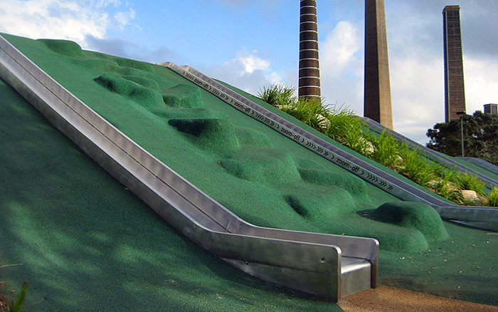 Fun concrete stepping stones covered by rubber 'soft fall' in Sydney Park