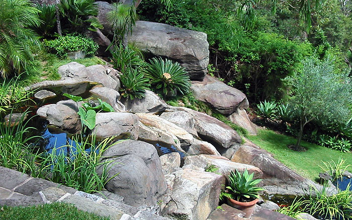 Private pond and waterfall  using artificial and real rocks - Sydney